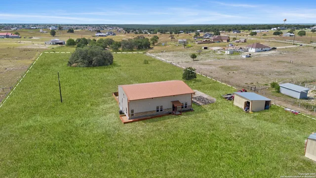 an aerial view of a house with a garden