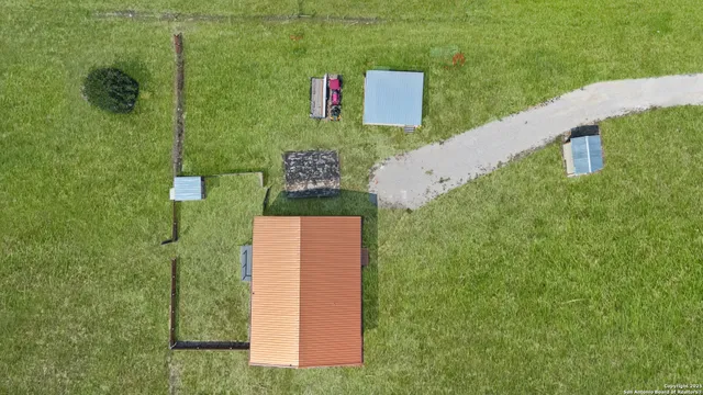 a spacious bathroom with a double vanity sink a mirror and a shower