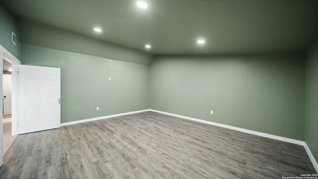 a bedroom with a bed and a television