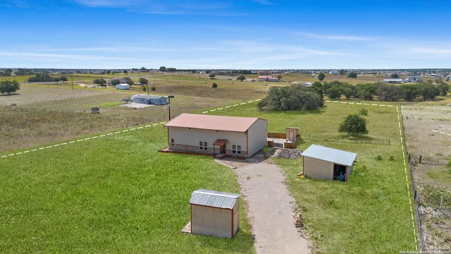 a view of kitchen with cabinets and wooden floor