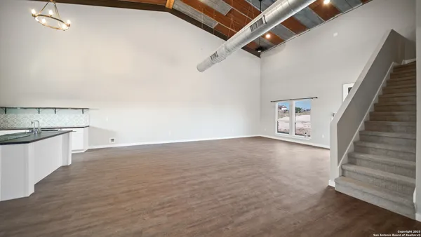 a view of living room with furniture and flat screen tv