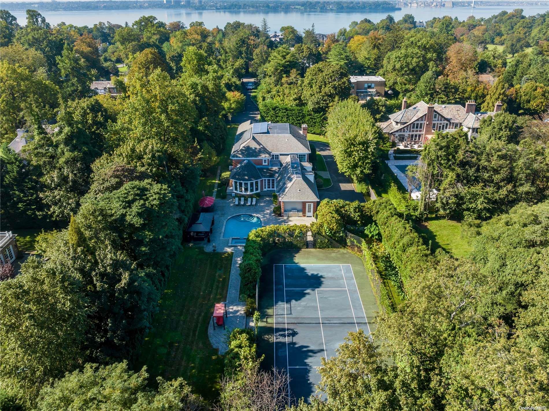 175 West Shore Road Great Neck, NY 11024 - Photo 1 of 1 an aerial view of a house with a yard swimming pool and outdoor seating