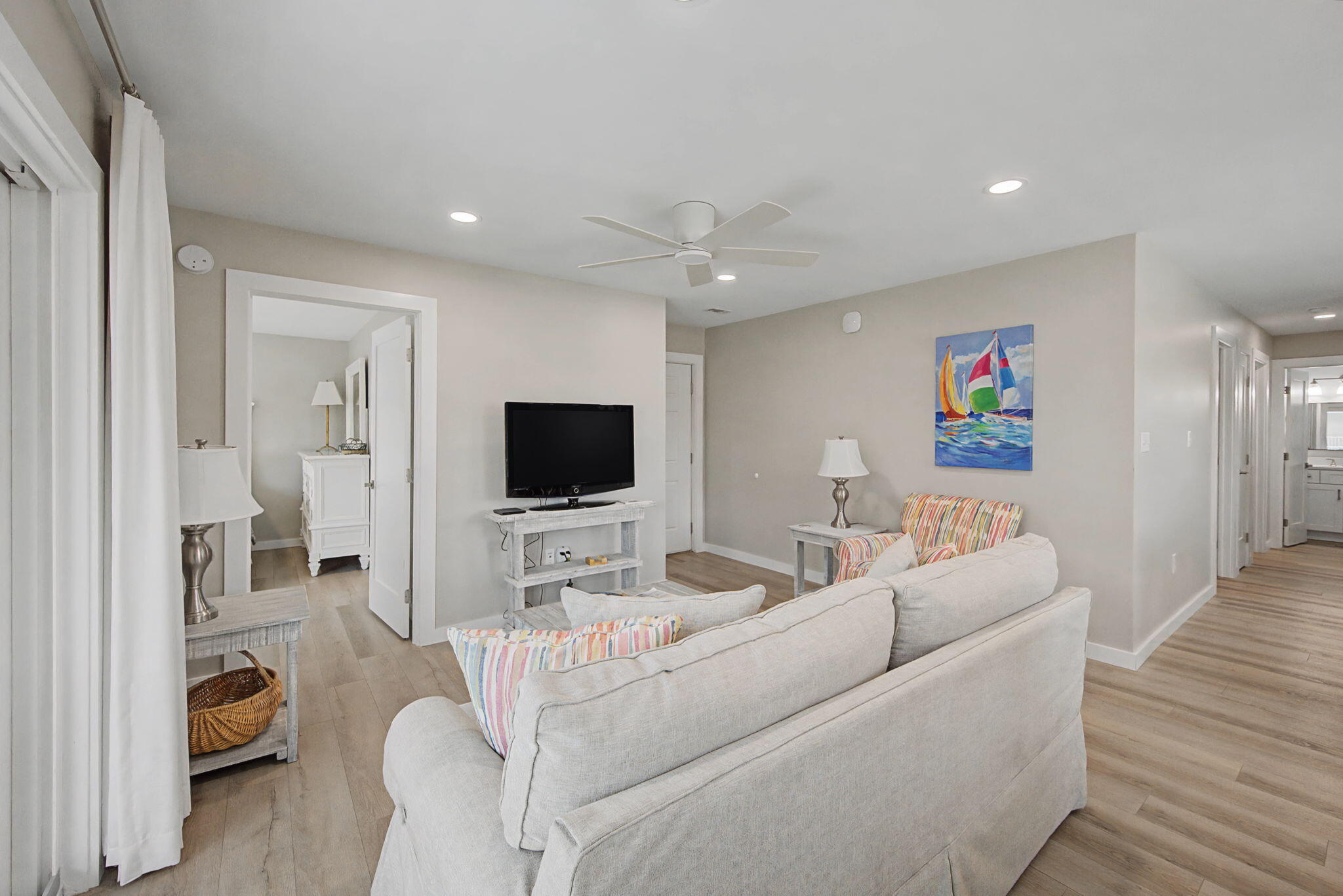 11 Beachside Drive, Unit 523 Santa Rosa Beach, FL 32459 - Photo 5 of 32 a living room with furniture and a flat screen tv