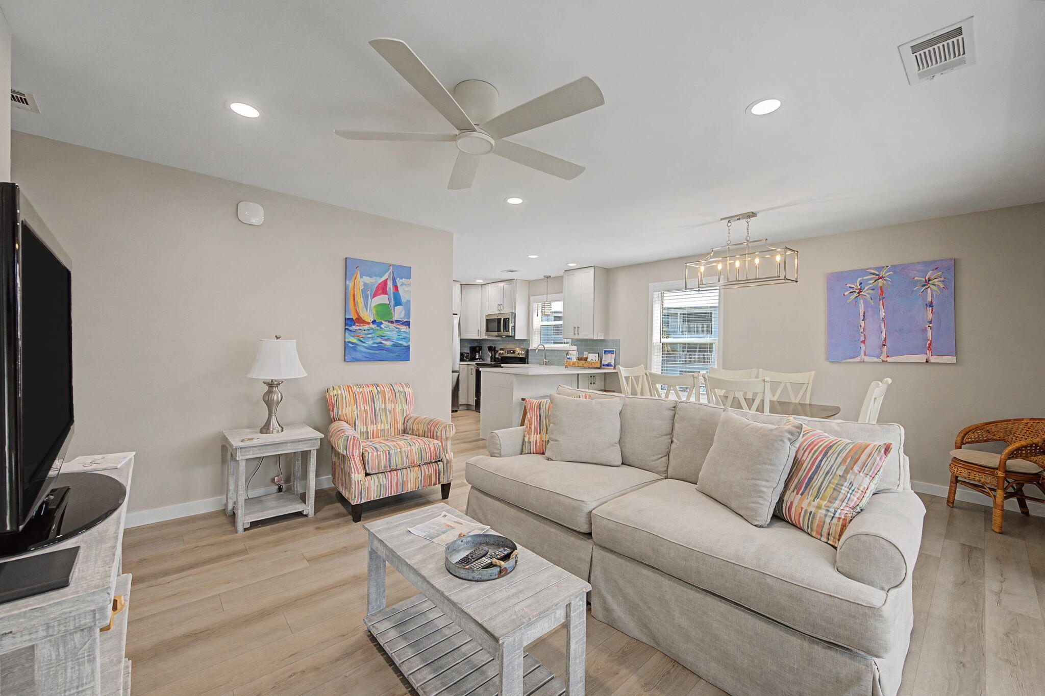 11 Beachside Drive, Unit 523 Santa Rosa Beach, FL 32459 - Photo 6 of 32 a living room with furniture a rug and a flat screen tv