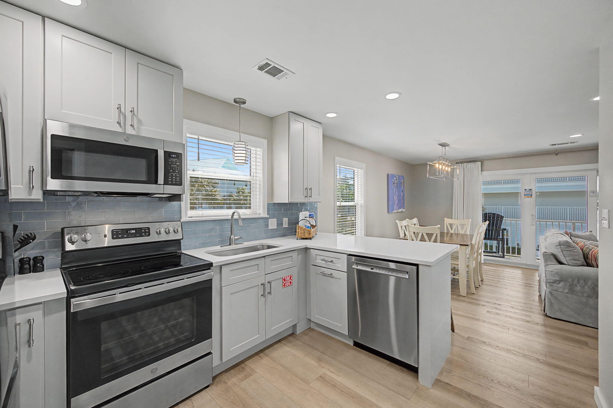 11 Beachside Drive, Unit 523 Santa Rosa Beach, FL 32459 - Photo 9 of 32 a kitchen with a sink stove and microwave