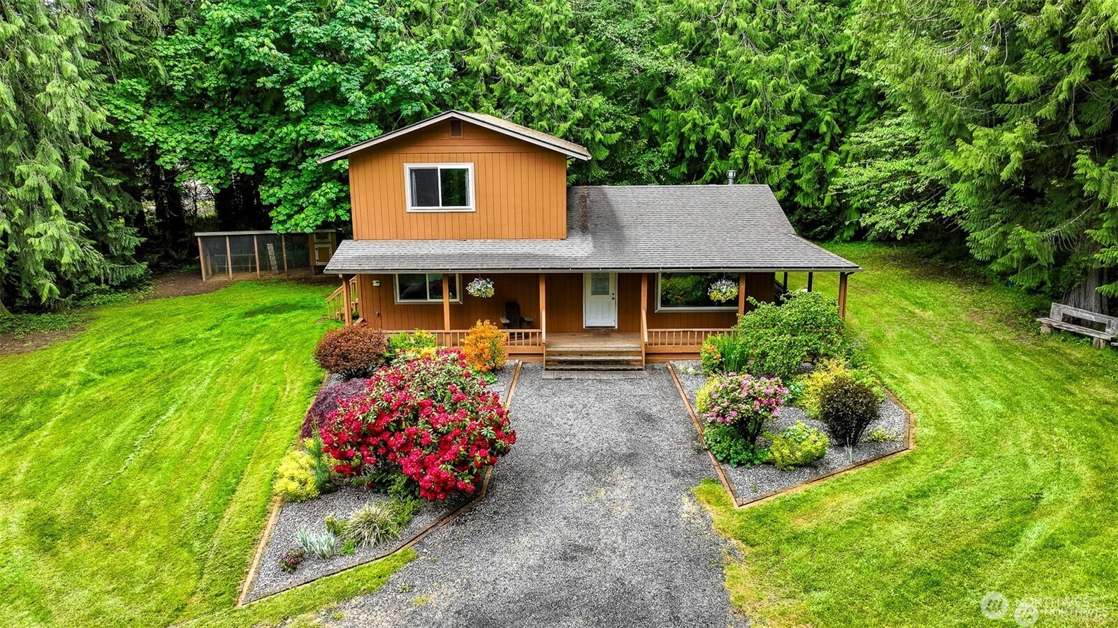 209 Alpha Way Onalaska, WA 98570 - Photo 1 of 40 a front view of a house with a yard and a garden