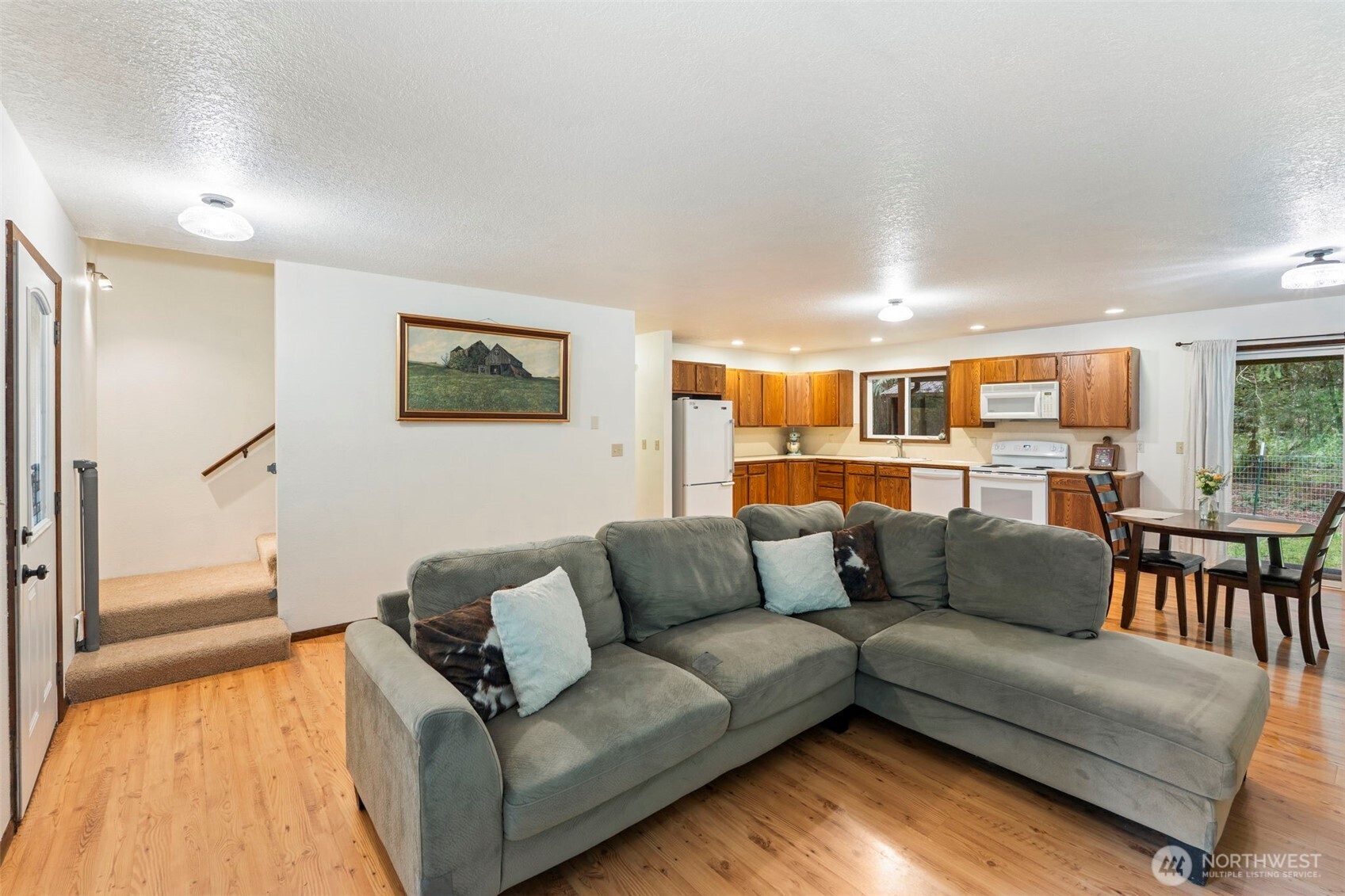 209 Alpha Way Onalaska, WA 98570 - Photo 17 of 40 a living room with furniture and a view of kitchen