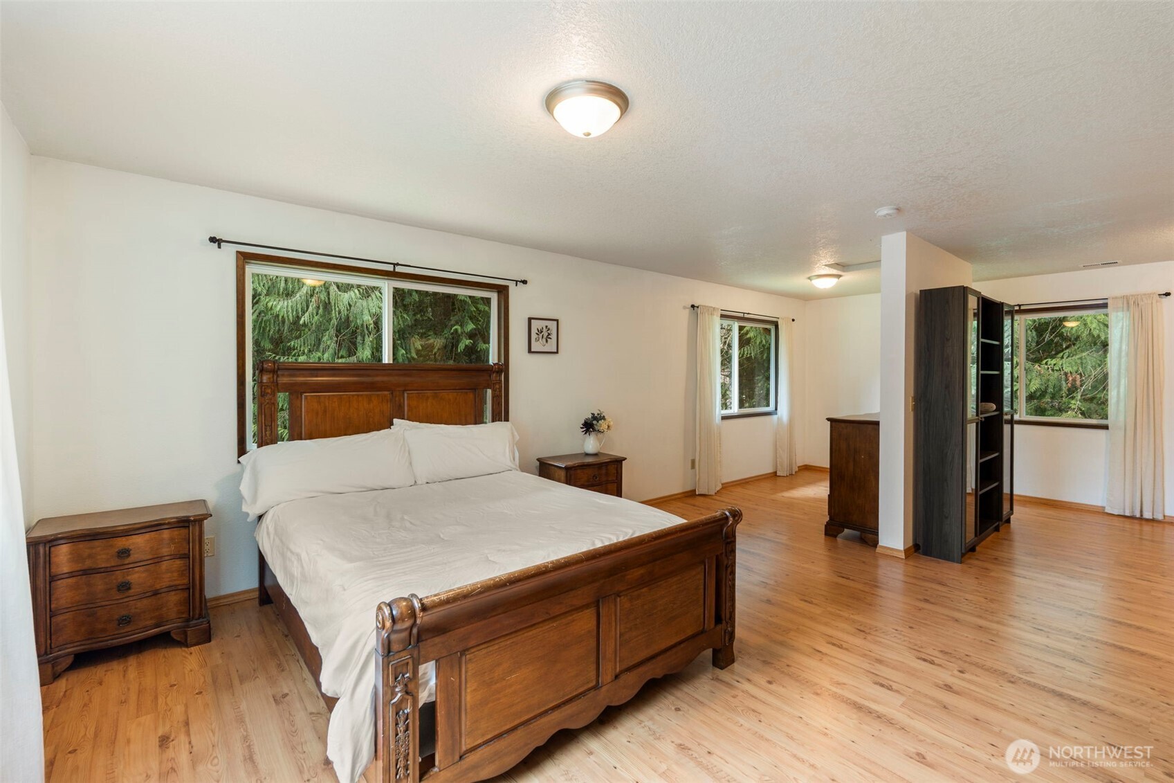 209 Alpha Way Onalaska, WA 98570 - Photo 20 of 40 a living room with a bed and a dresser