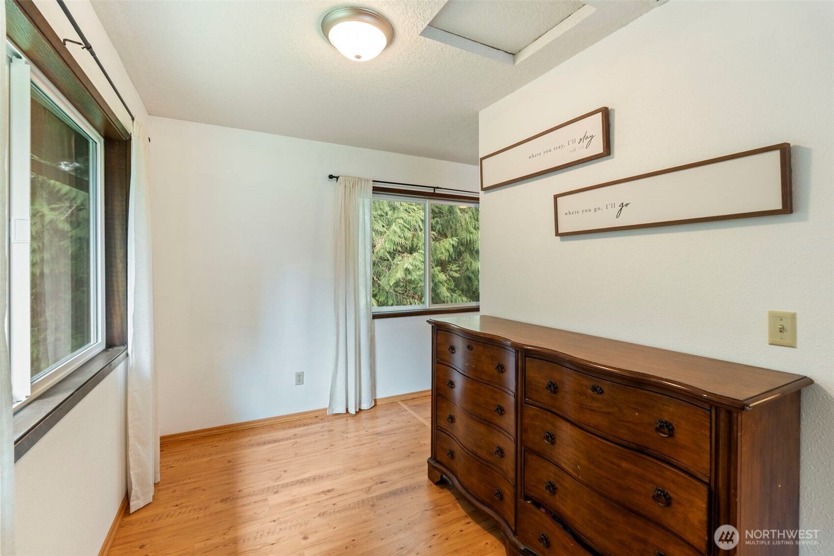 209 Alpha Way Onalaska, WA 98570 - Photo 22 of 40 a room with a dresser and a window