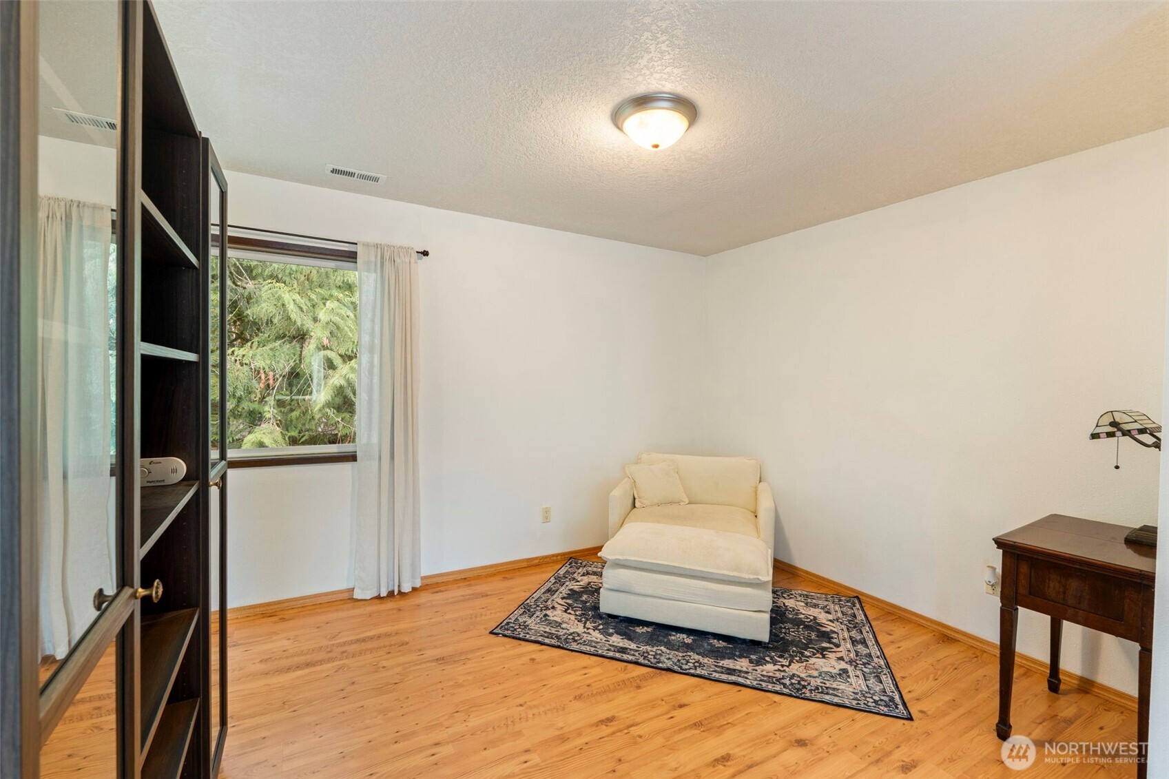 209 Alpha Way Onalaska, WA 98570 - Photo 23 of 40 a bedroom with a bed and a window