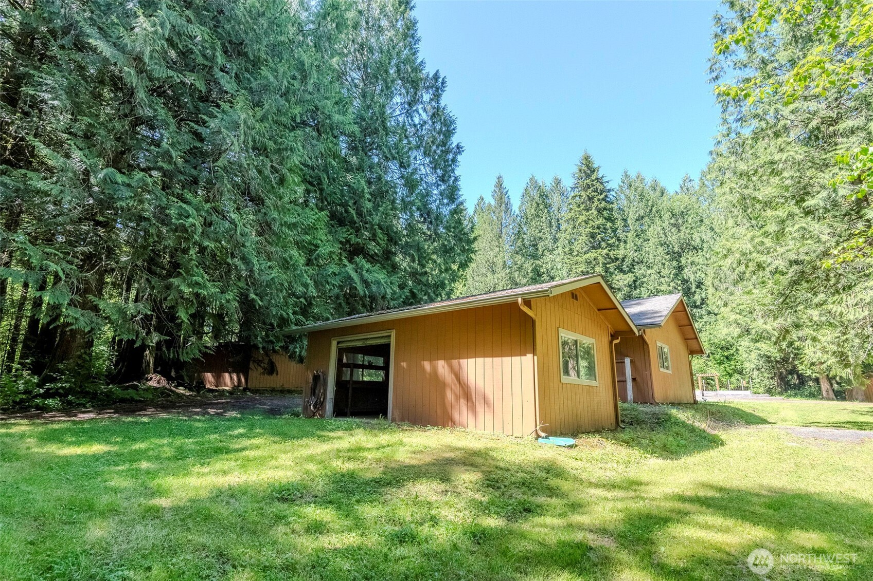 209 Alpha Way Onalaska, WA 98570 - Photo 33 of 40 a house with trees in front of it