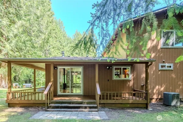 a view of a backyard with sitting area
