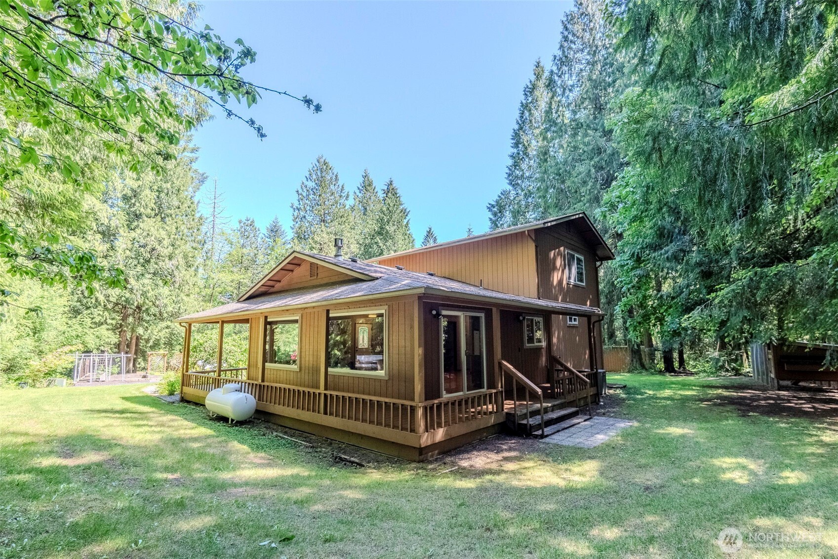 209 Alpha Way Onalaska, WA 98570 - Photo 5 of 40 a view of a house with a yard and wooden fence