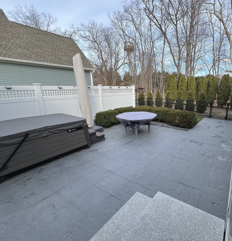 6 East Commons Drive, Unit 6 Hadley, MA 01035 - Photo 21 of 27 a backyard of a house with fountain table and chairs