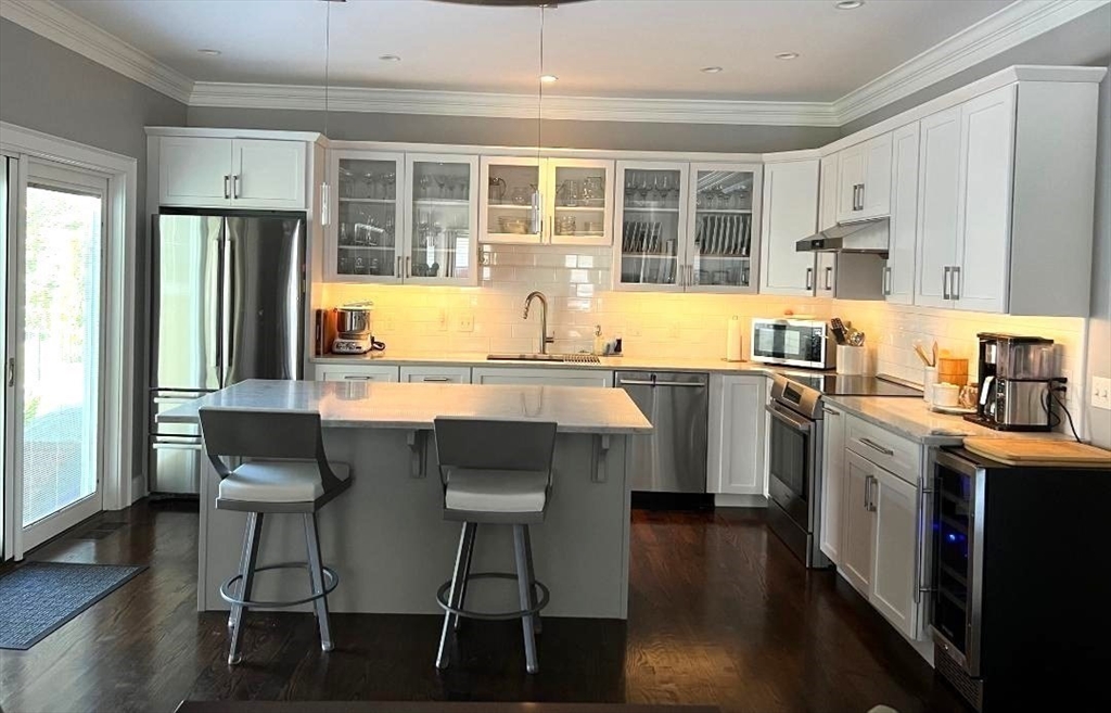 6 East Commons Drive, Unit 6 Hadley, MA 01035 - Photo 4 of 27 a kitchen with stainless steel appliances granite countertop a stove and a refrigerator