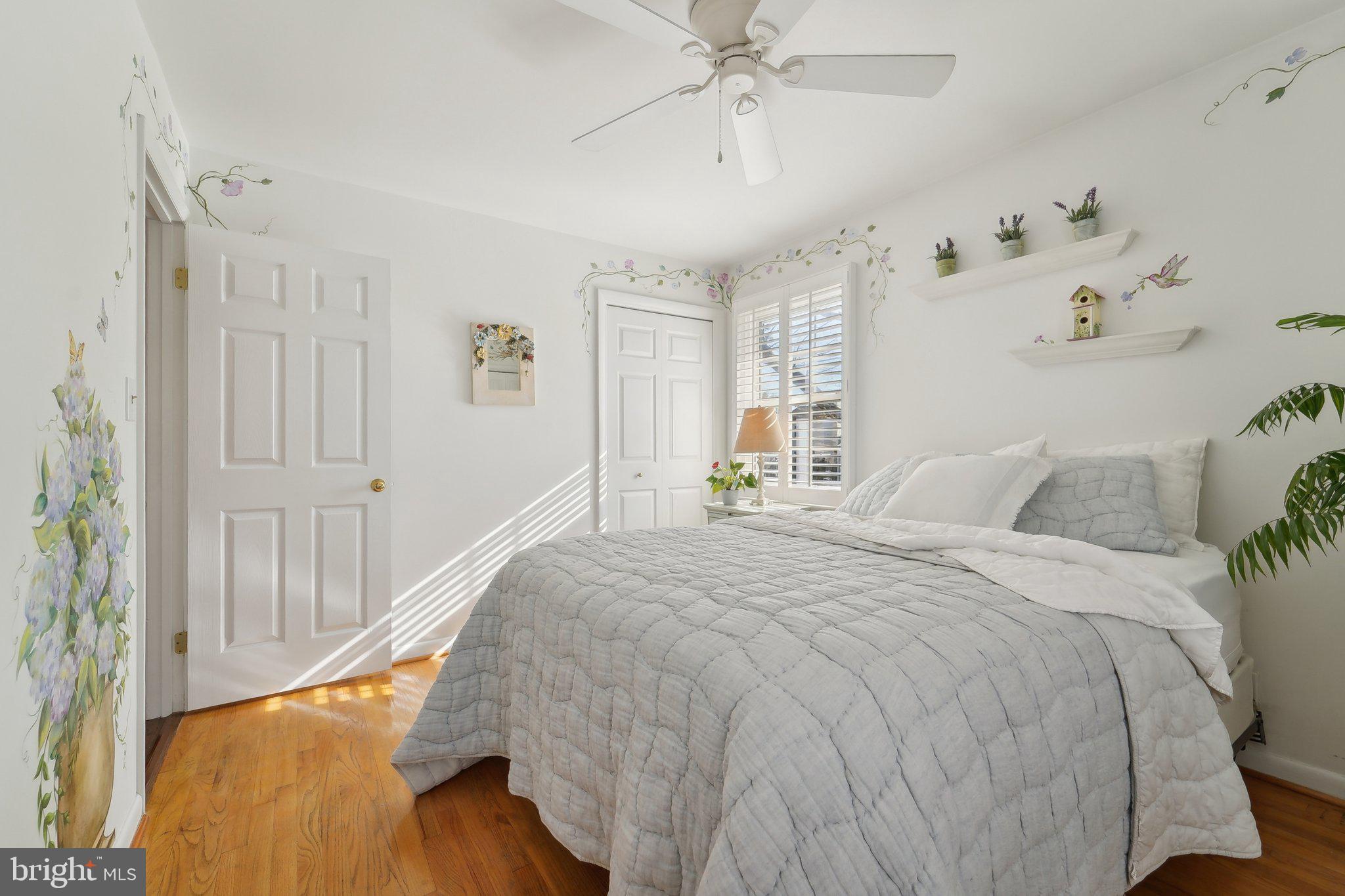 901 Mark Road Baltimore, MD 21225 - Photo 14 of 39 a bedroom with a bed and a chandelier