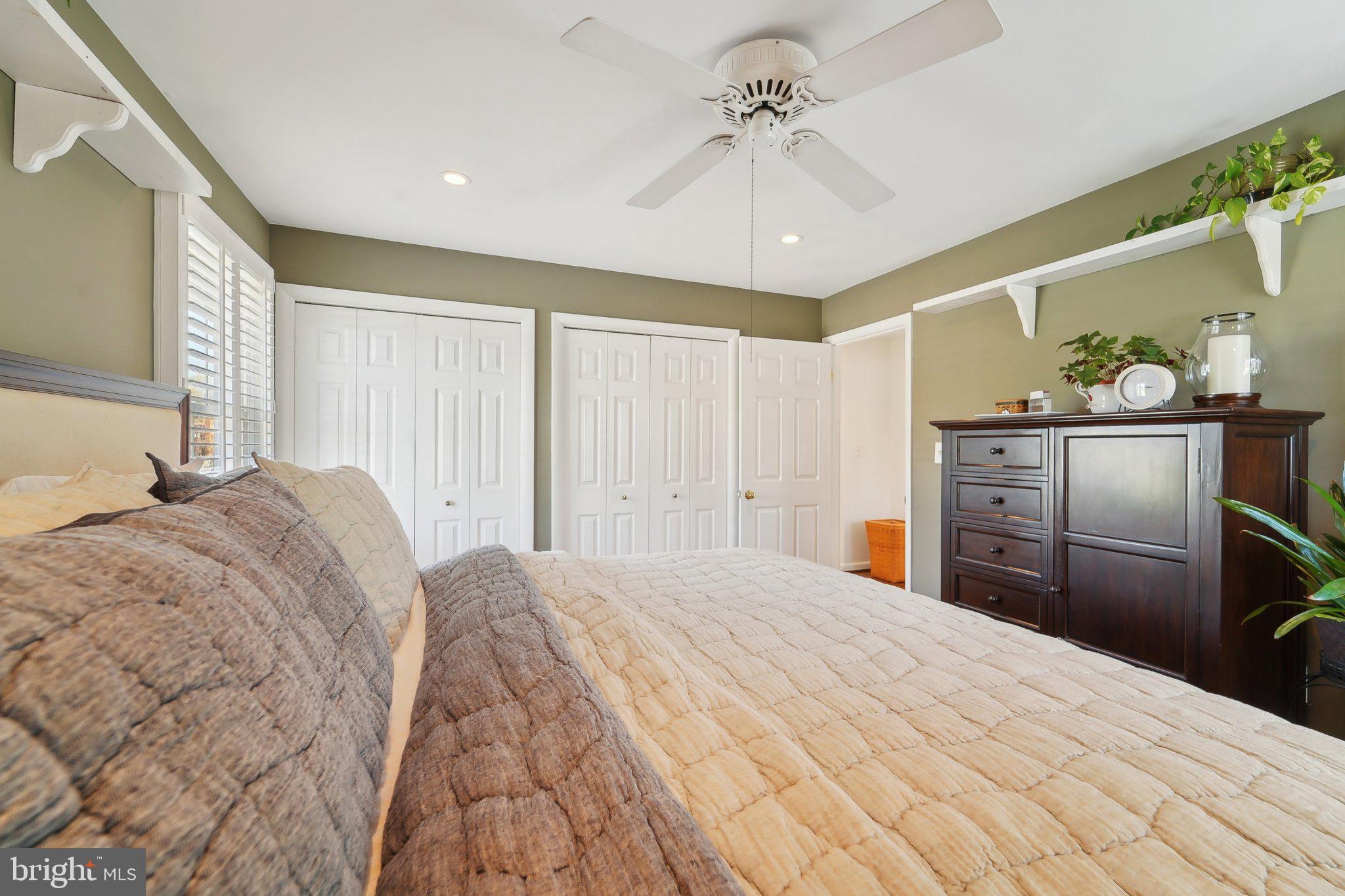 901 Mark Road Baltimore, MD 21225 - Photo 16 of 39 a bedroom with a bed and a chandelier