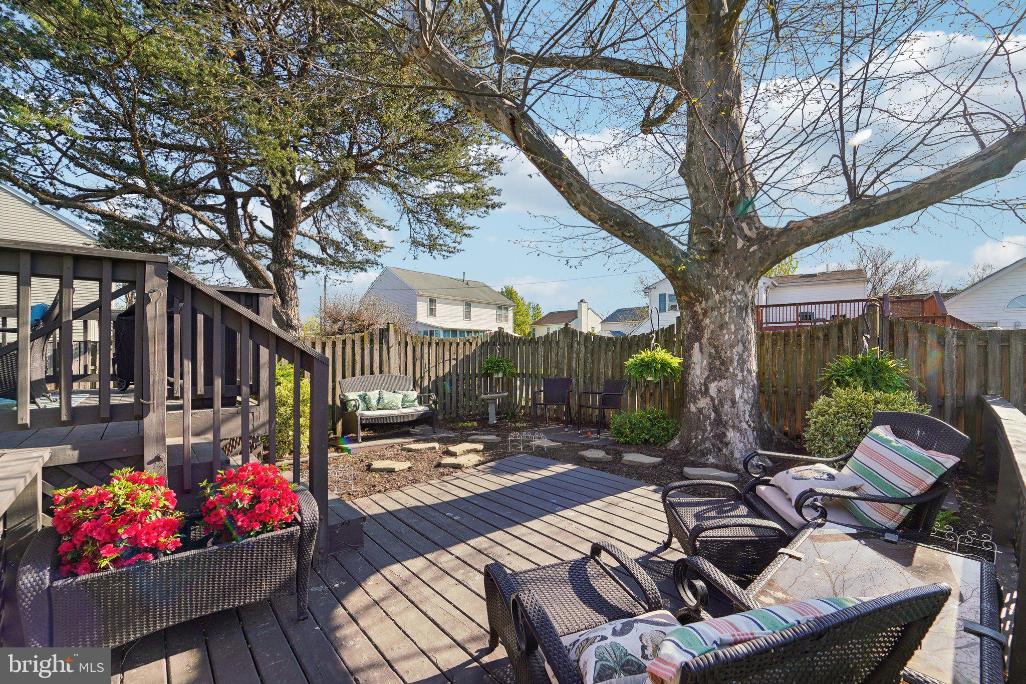901 Mark Road Baltimore, MD 21225 - Photo 29 of 39 a view of a patio with couches table and chairs and potted plants