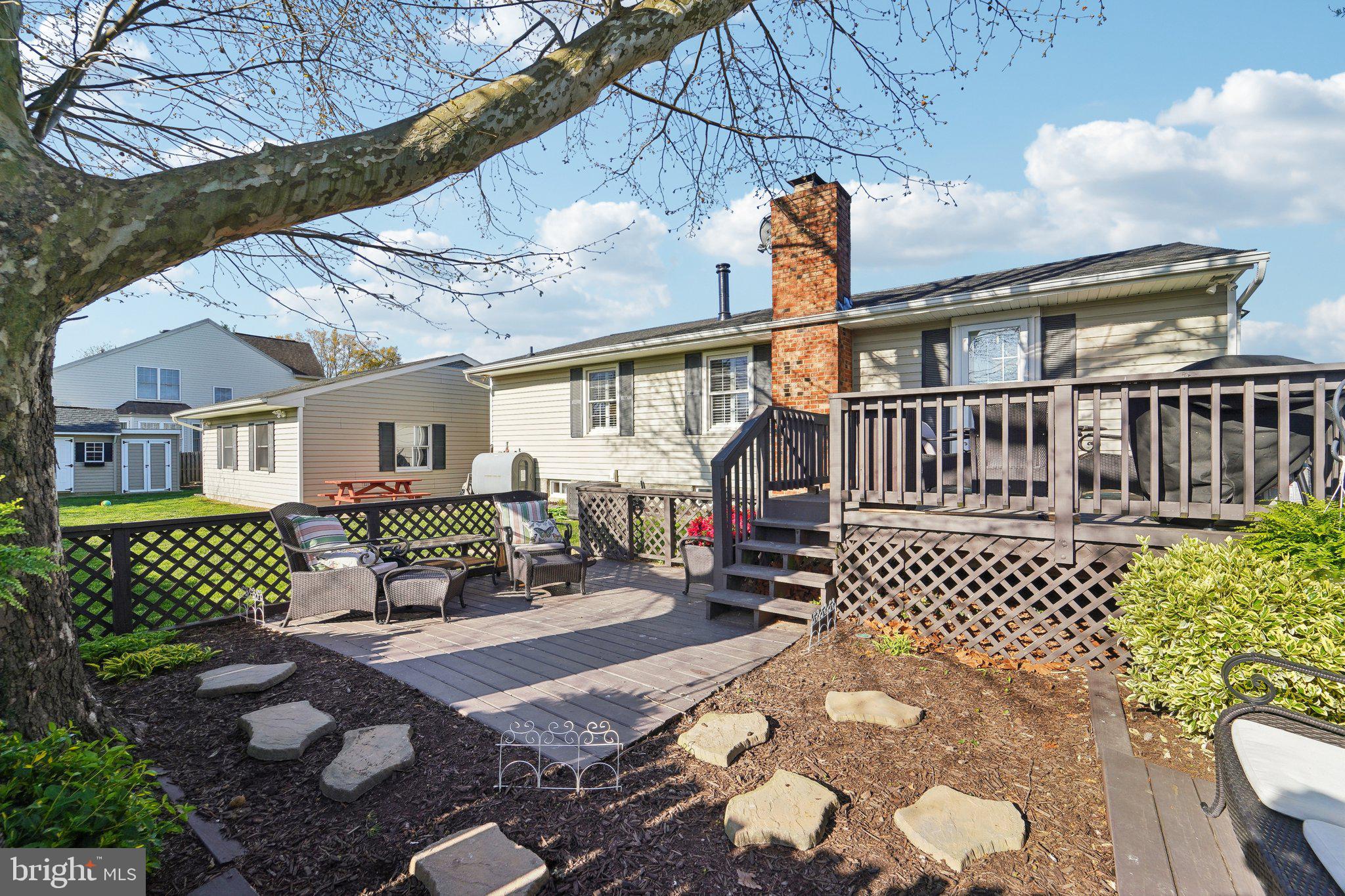 901 Mark Road Baltimore, MD 21225 - Photo 30 of 39 a view of a brick house with wooden fence