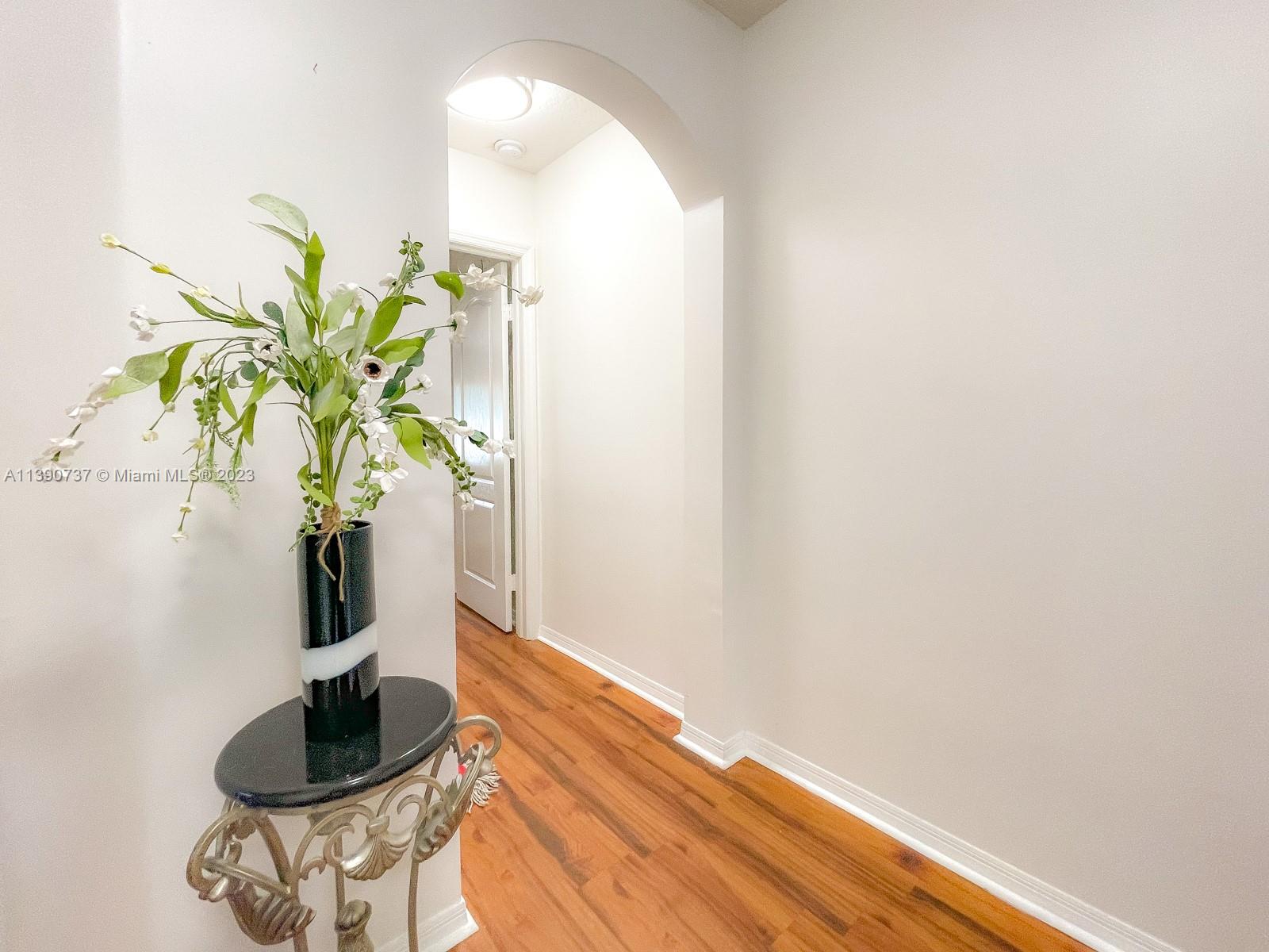 3136 Southwest 129th Way, Unit 157 Miramar, FL 33027 - Photo 14 of 23 a vase of flowers sitting on a table