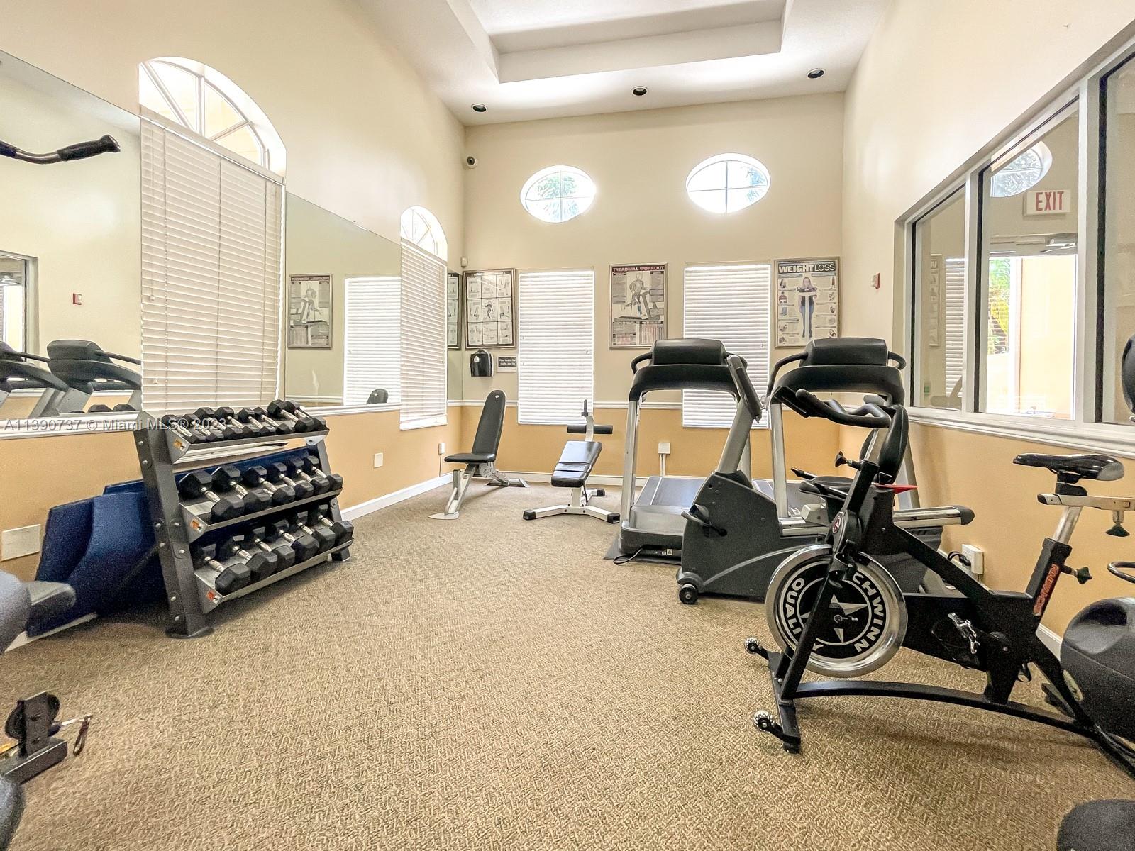 3136 Southwest 129th Way, Unit 157 Miramar, FL 33027 - Photo 22 of 23 a bedroom with furniture and a large window