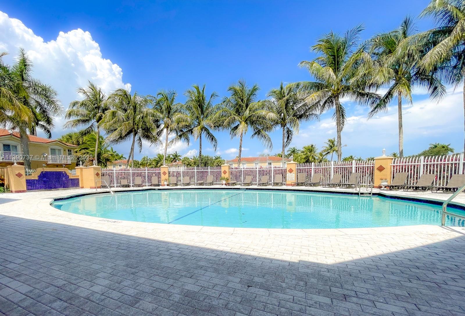 3136 Southwest 129th Way, Unit 157 Miramar, FL 33027 - Photo 23 of 23 a view of swimming pool and lake view
