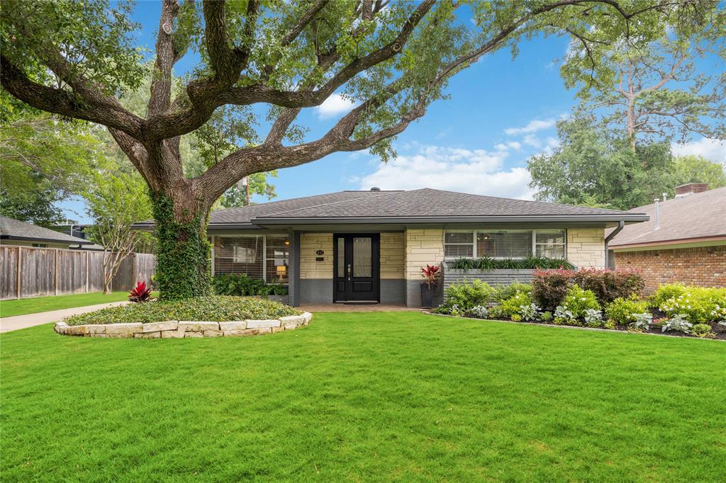 This stunning Garden Oaks home offers a unique layout with incredible features. Look at the exquisite landscaping in front including a beautiful mature oak!