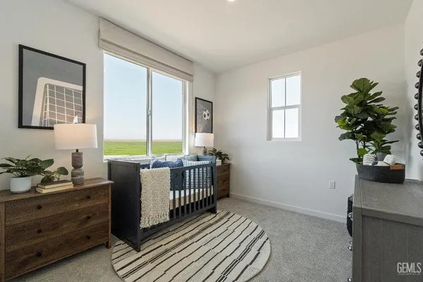a bed room with furniture and a window