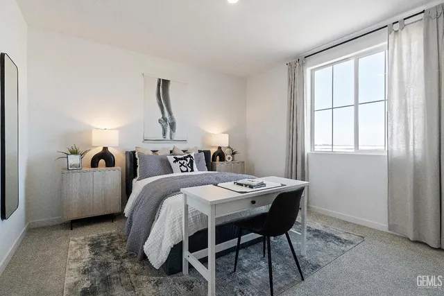 a bed room with a bed and a table