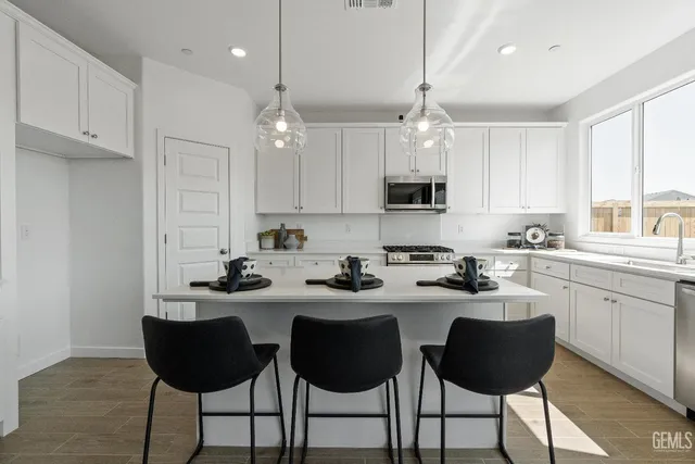 a kitchen with a sink and cabinets