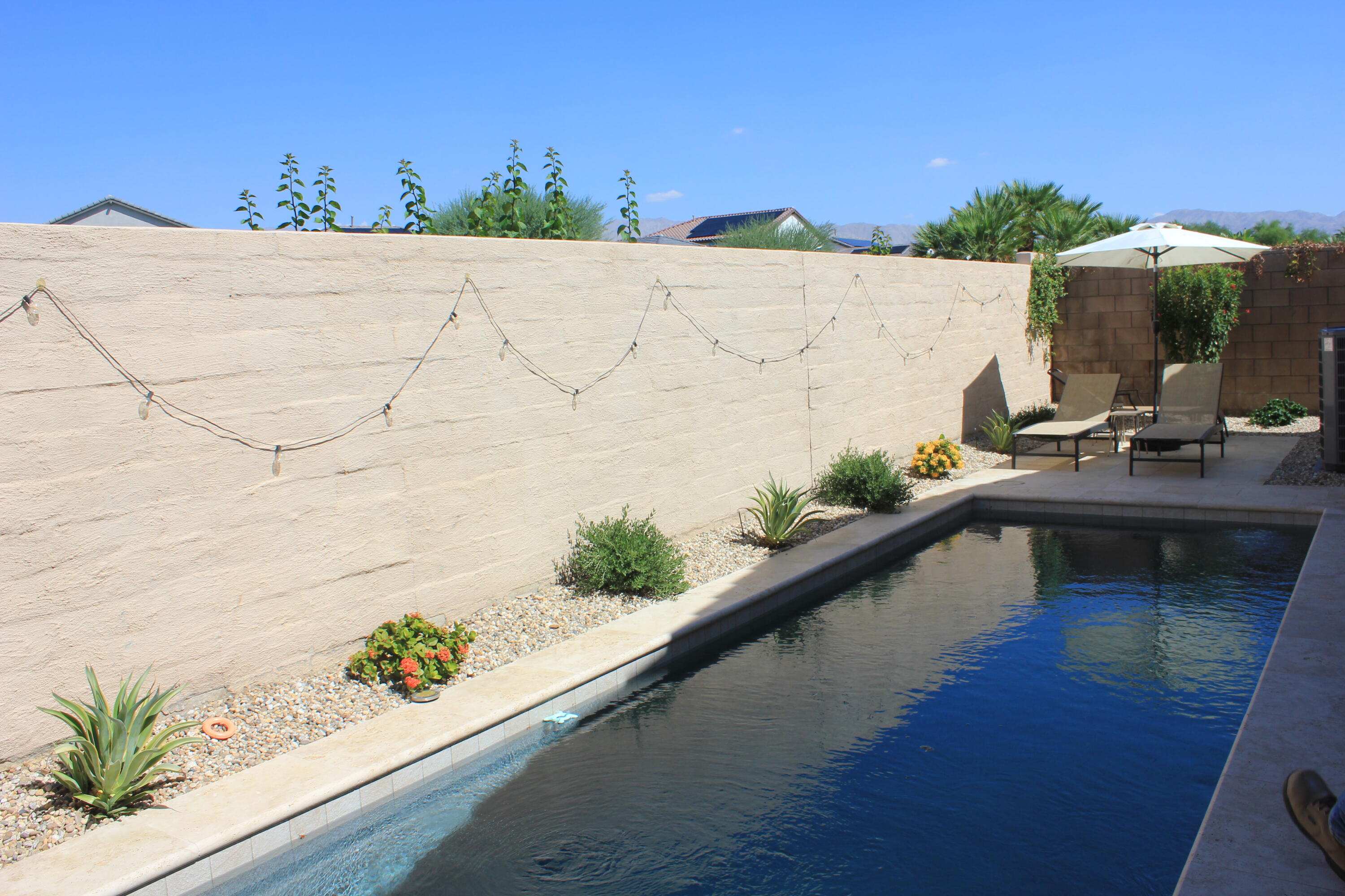 a view of swimming pool from a balcony