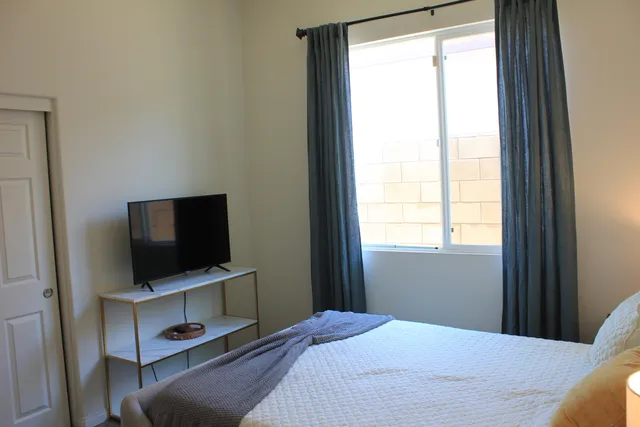 a view of a livingroom with a flat screen tv