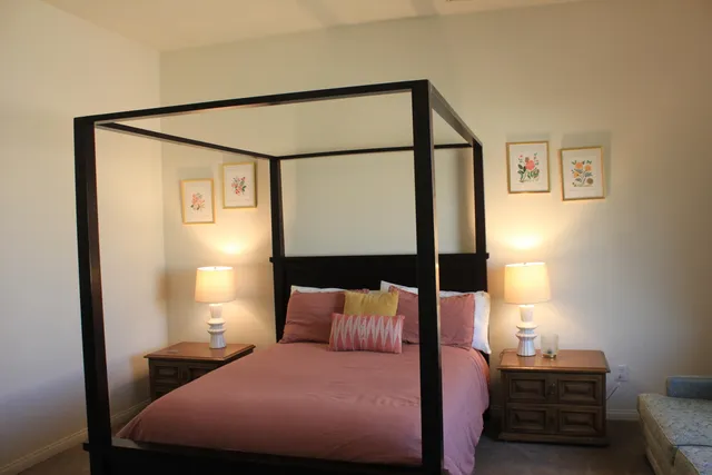 a view of a livingroom with furniture and a chandelier