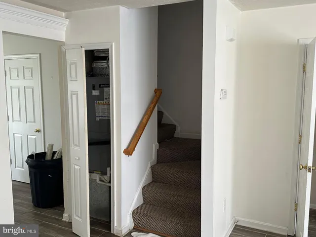 hallway with two windows and a room