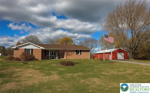 a view of a house with a big yard