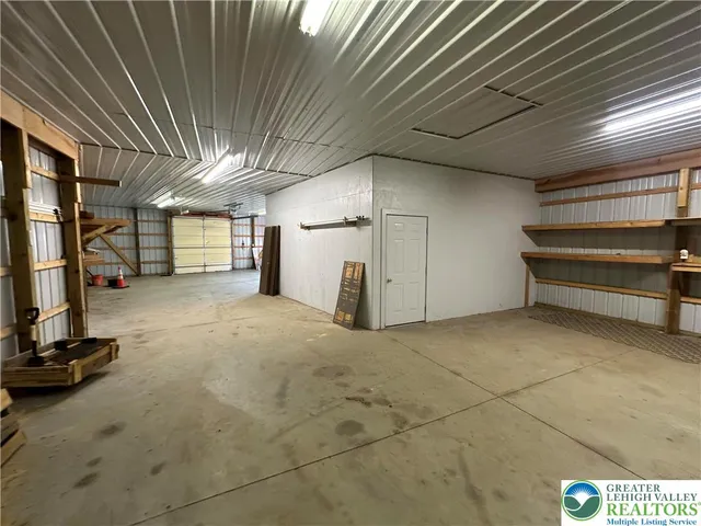 a street view with large trees