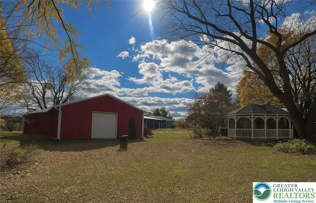 a view of street with large trees