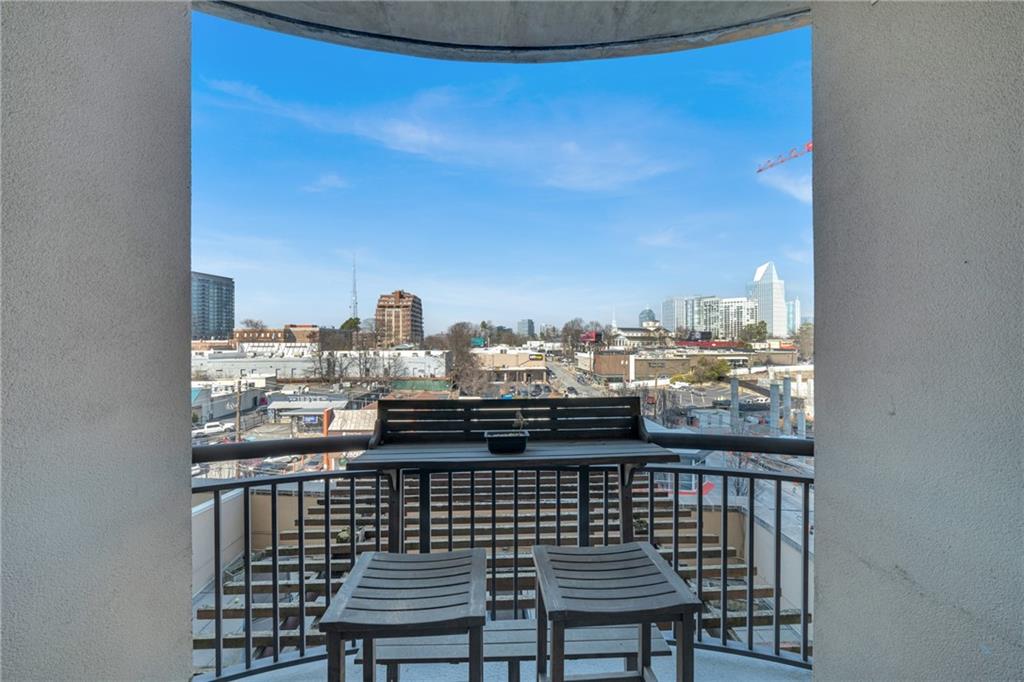 325 East Paces Ferry Road Northeast, Unit 601 Atlanta, GA 30305 - Photo 15 of 28 a view of a balcony with city view