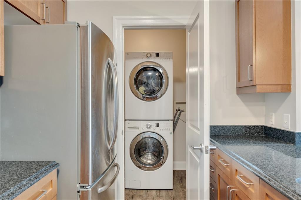 325 East Paces Ferry Road Northeast, Unit 601 Atlanta, GA 30305 - Photo 6 of 28 a utility room with dryer and washer