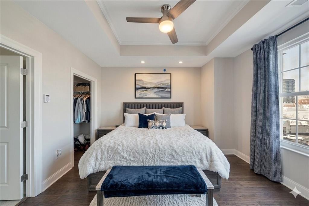 325 East Paces Ferry Road Northeast, Unit 601 Atlanta, GA 30305 - Photo 10 of 28 a bedroom with a large bed and a window