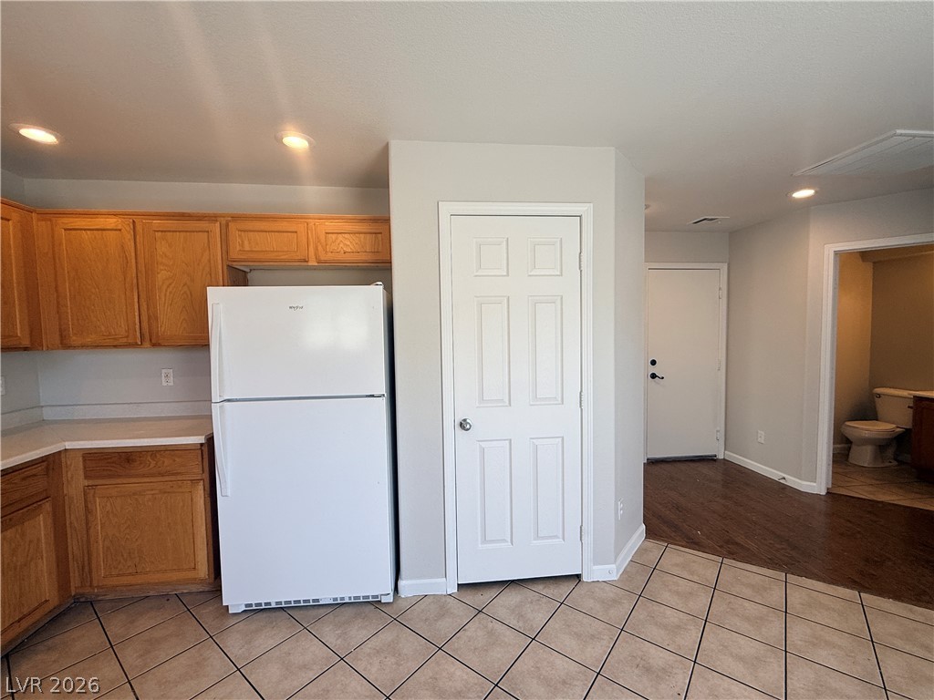 11953 Fairfax Ridge Street Las Vegas, NV 89183 - Photo 8 of 32 Functional kitchen with ample cabinetry and easy access to additional rooms.