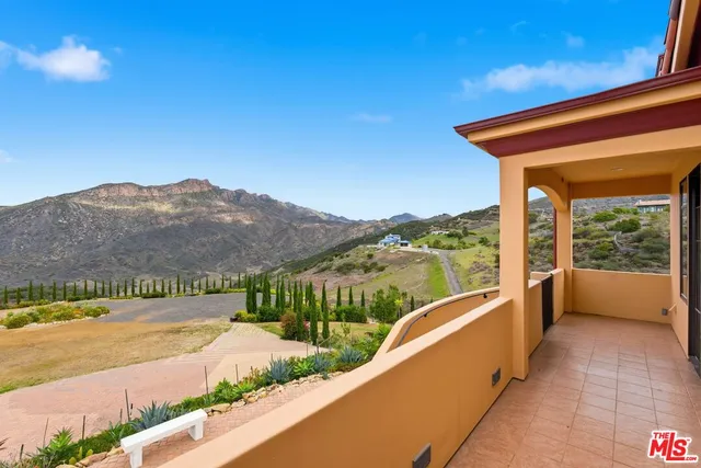 a view of a swimming pool with a balcony