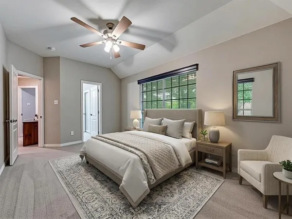 a bedroom with a large bed and a couch