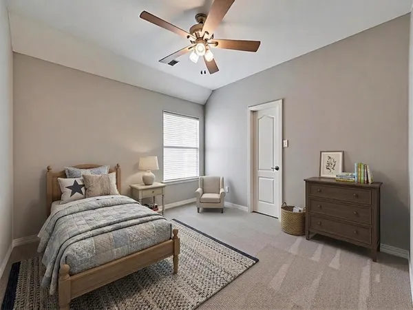 a bedroom with a bed and window