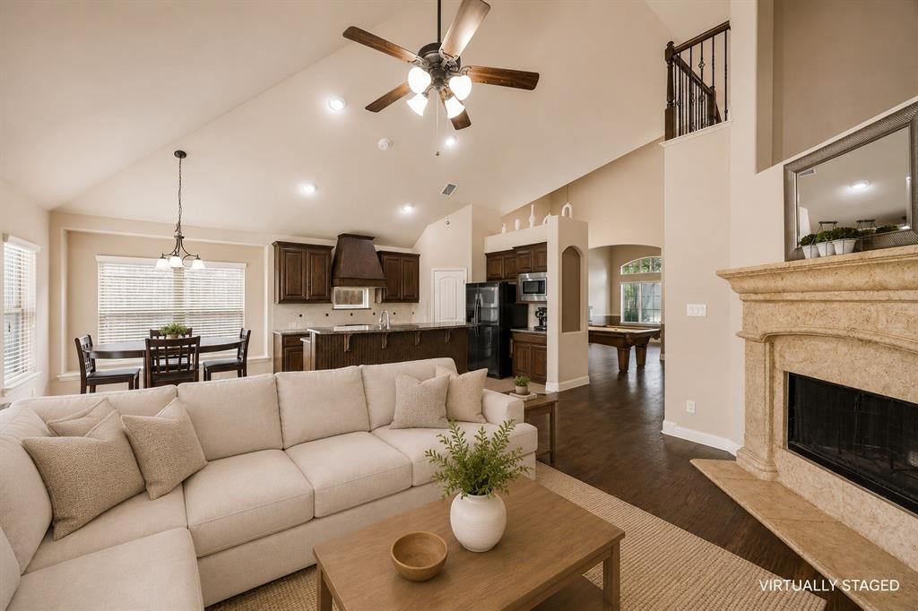 1014 Dunhill Lane Forney, TX 75126 - Photo 9 of 38 Another view of the living room that is open to the breakfast and kitchen area.
