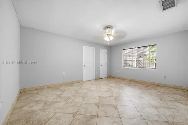 a view of an empty room with a window