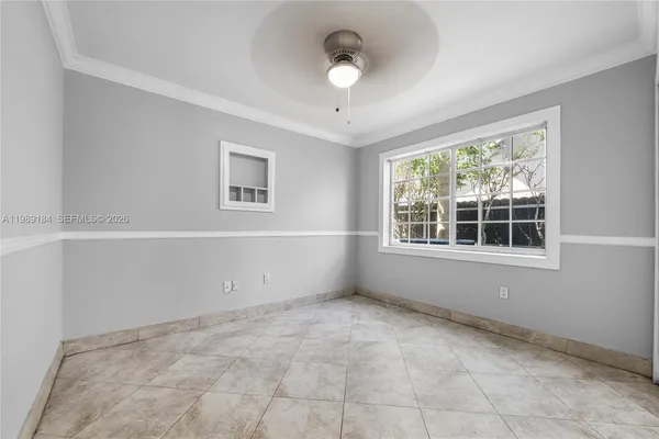 a view of an empty room with a window