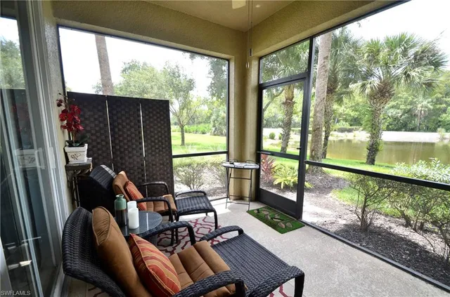 a living room with large windows