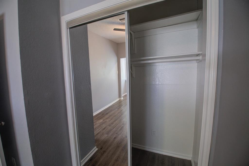 2606 Rio Grande Street, Unit 305 Austin, TX 78705 - Photo 11 of 18 a walk in closet with wooden floor