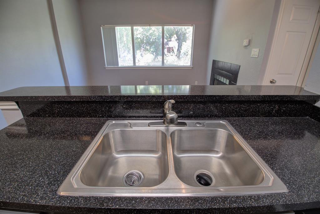 2606 Rio Grande Street, Unit 305 Austin, TX 78705 - Photo 4 of 18 a close view of sink and tap